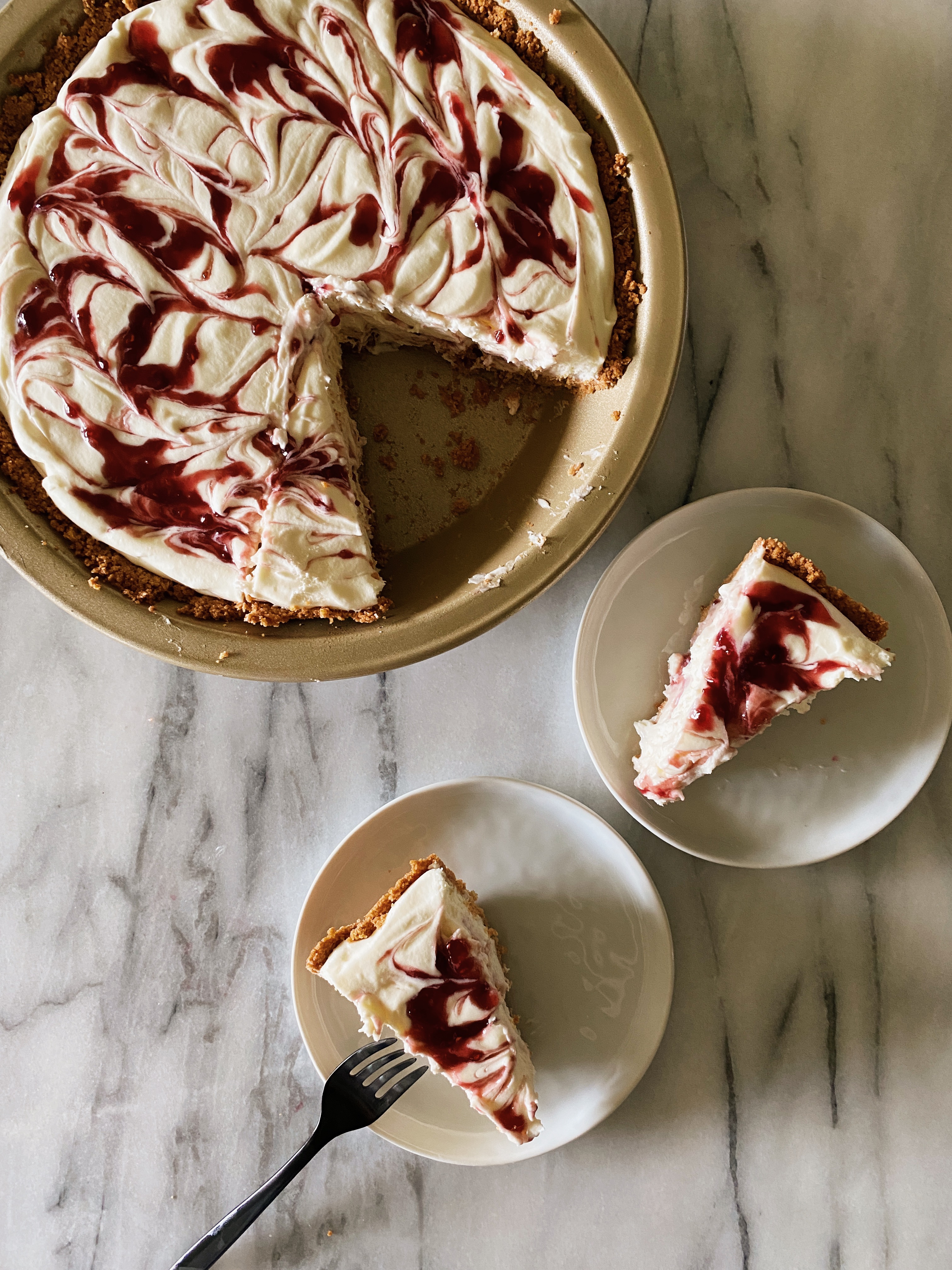 sliced white chocolate raspberry pie